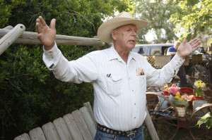 Rancher Cliven Bundy gestures at his home in Bunkerville