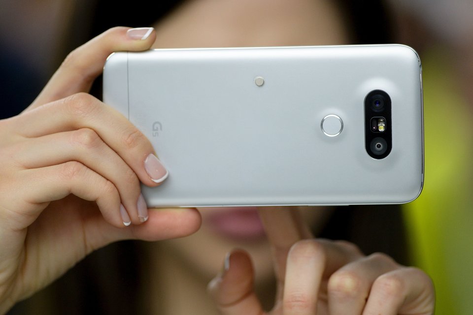 The "home" button and fingerprint sensor on the backside will be a new feature. Photo Credit: Getty Images