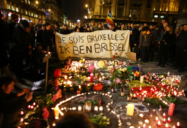 BRUSSELS, BELGIUM - MARCH 22:  People hold up a banner as a mark of solidarity at the Place de la Bourse following today's attacks on March 22, 2016 in Brussels, Belgium. At least 31 people are thought to have been killed after Brussels airport and a Metro station were targeted by explosions. The attacks come just days after a key suspect in the Paris attacks, Salah Abdeslam, was captured in Brussels.  (Photo by Carl Court/Getty Images)