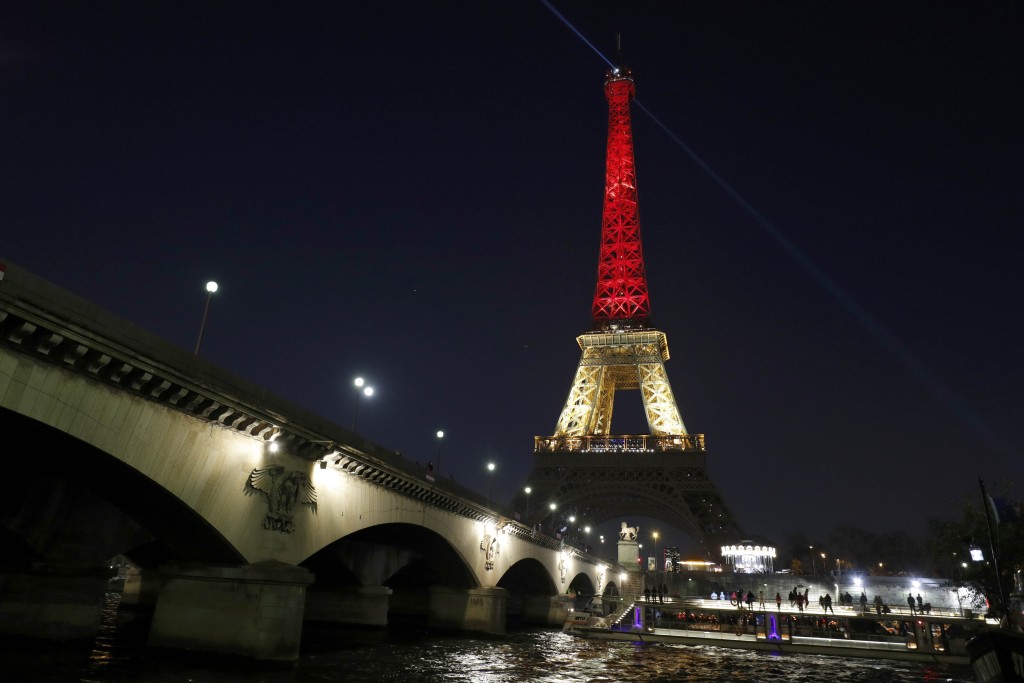 The Eiffel Tower in Paris paying Tribute to the victims in Brussels attack with the tower showing off the colors of the Belgian flag. Photo Credit: Google