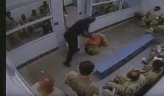 guard beats up inmate