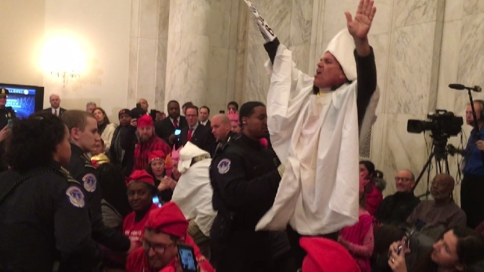 Protestors Dressed As KKK Members Ejected From Senator Jeff Sessions Senate Confirmation Shouts, “You Can’t Arrest Me, I’m A White Man!”